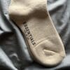 FullSizeRender Essentials logo print socks (OH)